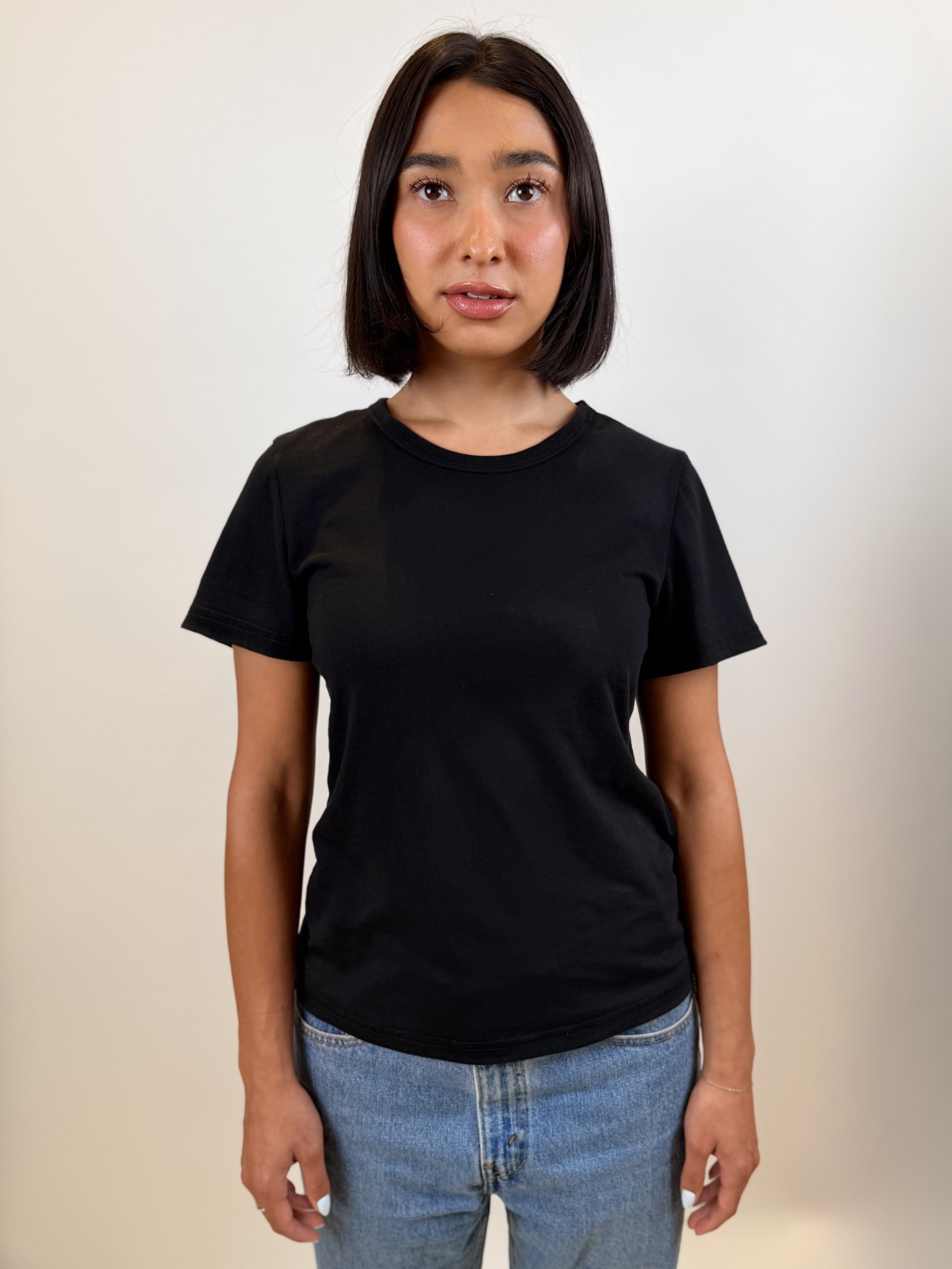 The Shortie Sleeve Tee in black, front view
