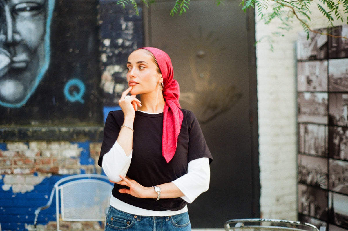 Dana Mosa-Basha wears The Short Sleeve in Black layered over The Three-Quarter Sleeve